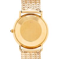 CORUM, REF. 89127 18K YELLOW GOLD DATE WATCH
