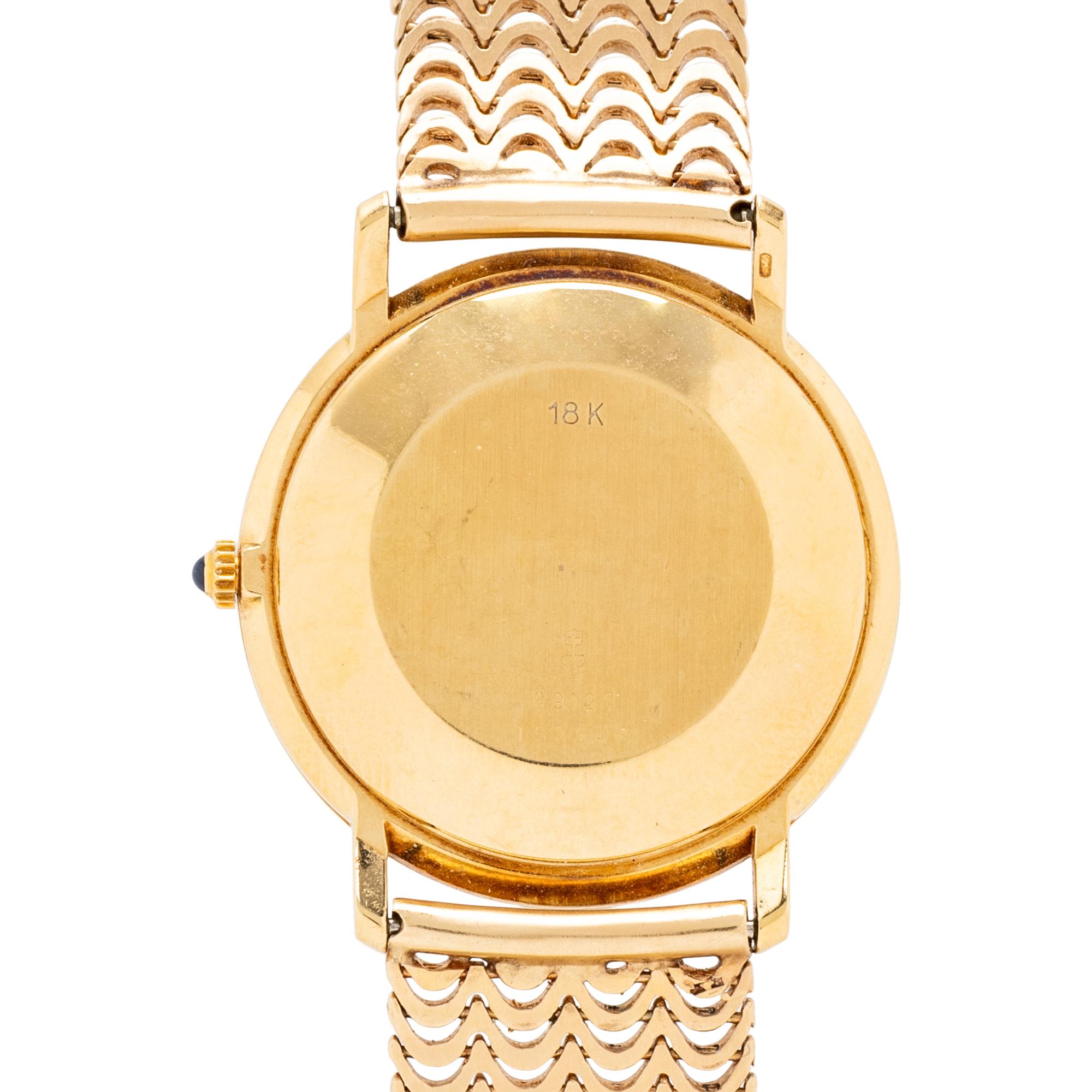 CORUM, REF. 89127 18K YELLOW GOLD DATE WATCH