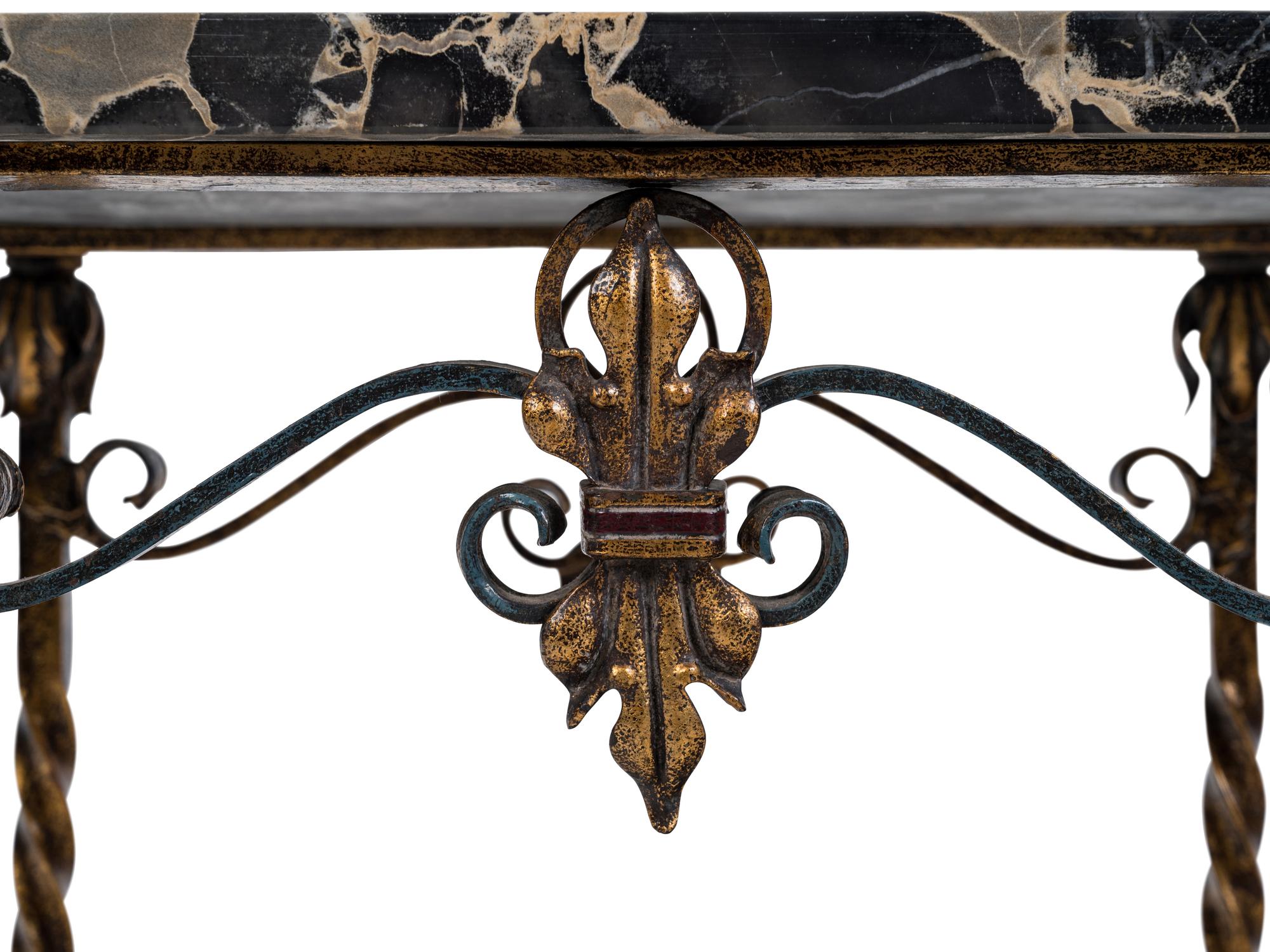 A Wrought Iron and Marble-Top Table