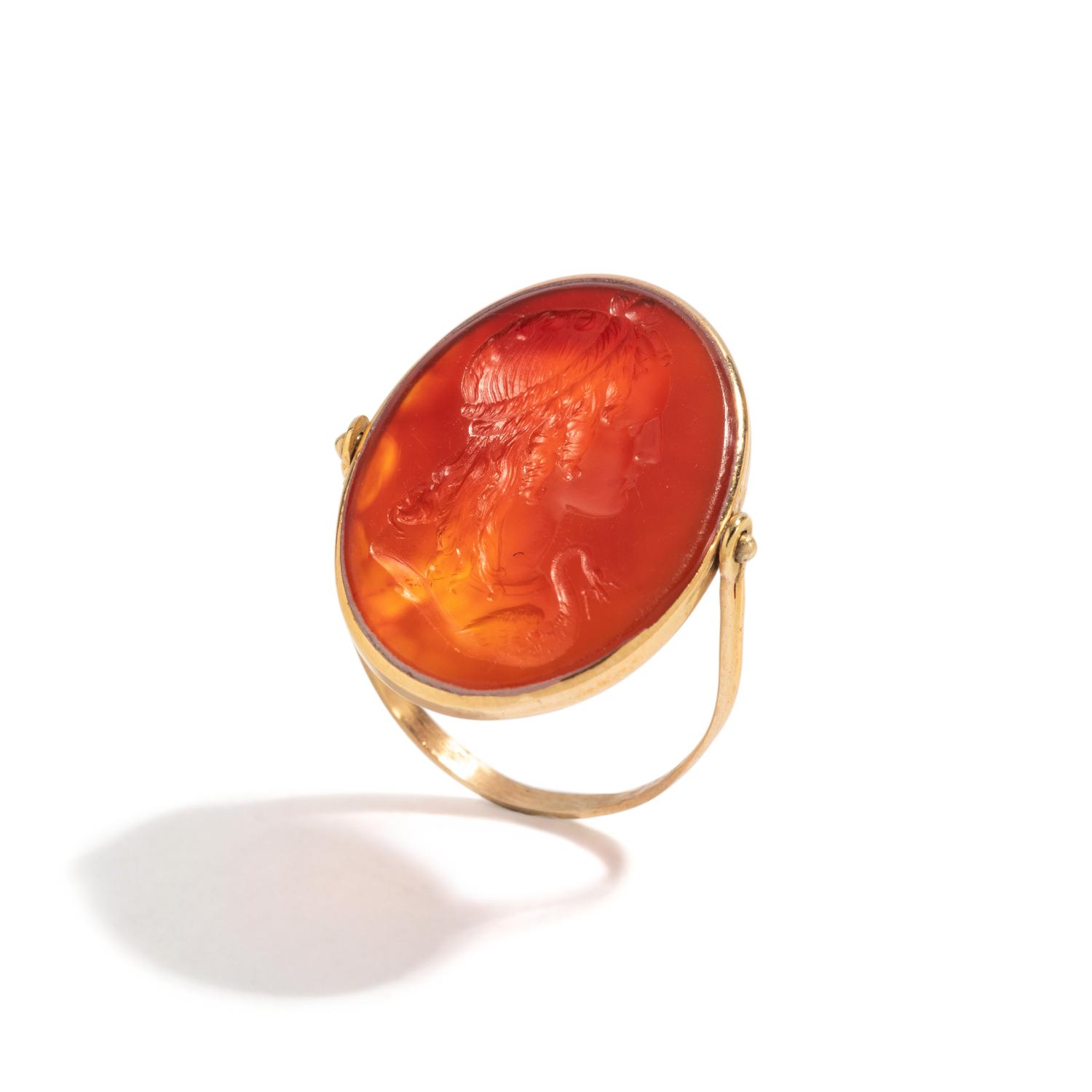 A Neoclassical Gold and Carnelian Swivel Ring with the Princess Leda