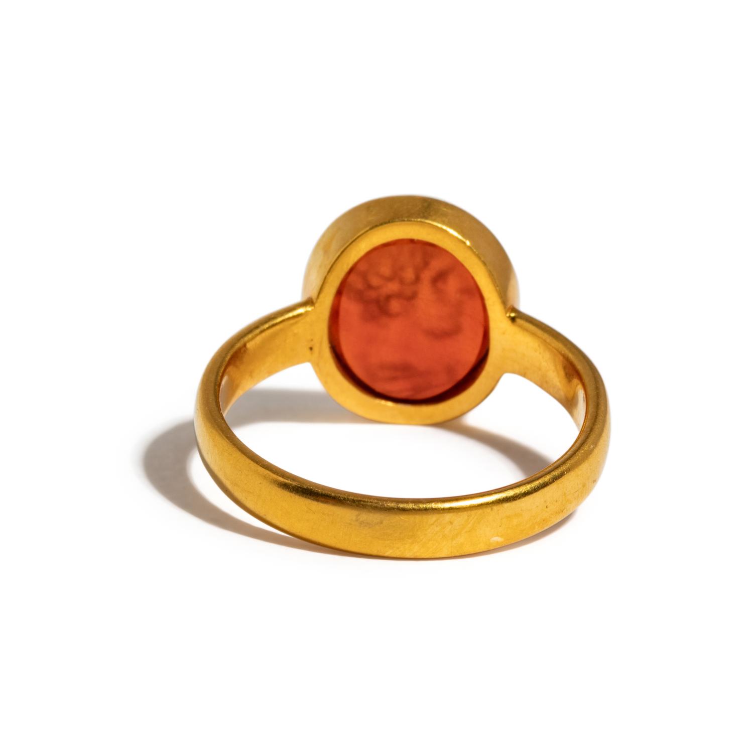 A Roman Carnelian Ring Stone with the Portrait Head of a Young Hercules — Set in a gold ring