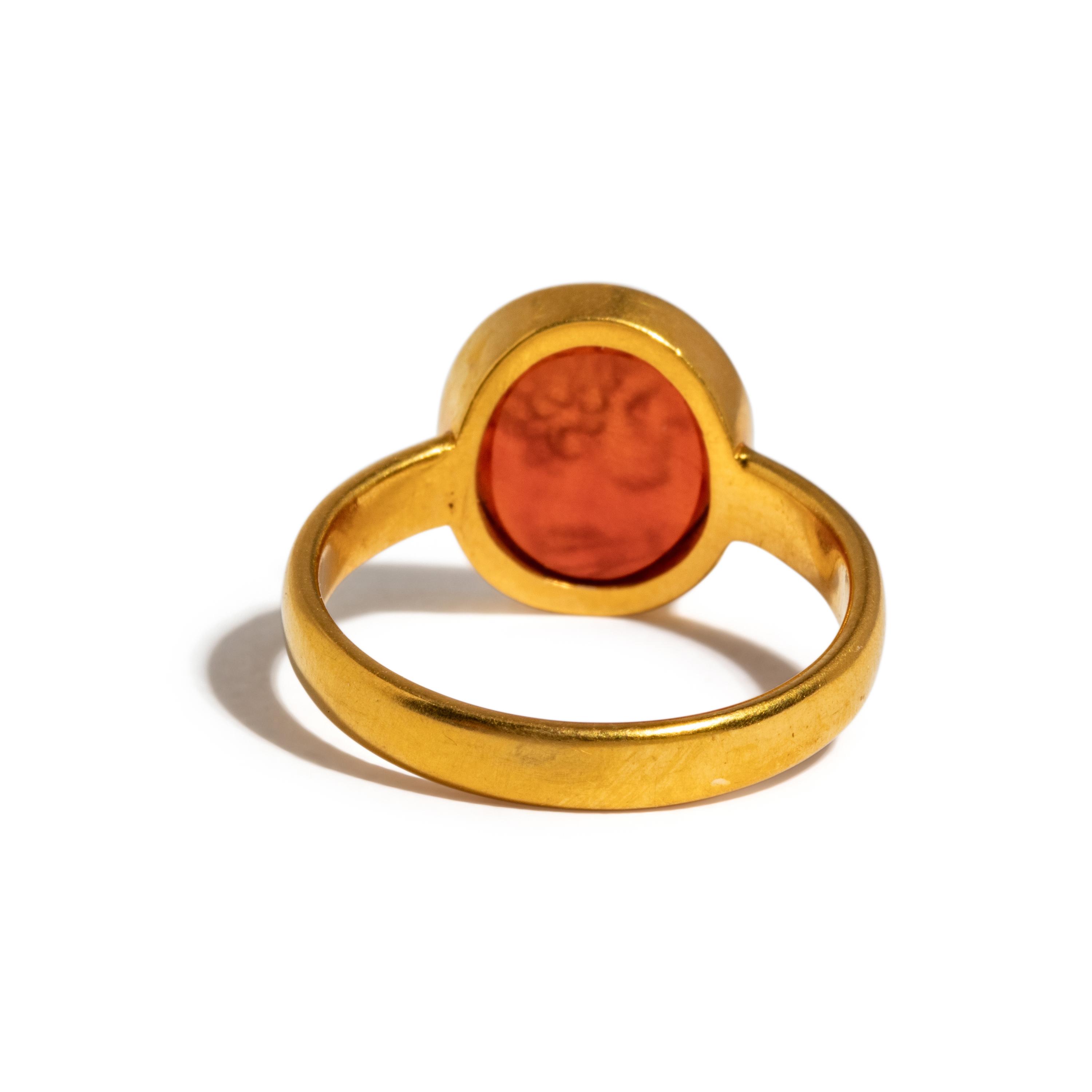 A Roman Carnelian Ring Stone with the Portrait Head of a Young Hercules — Set in a gold ring