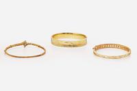 A Collection of Yellow Gold Bangles