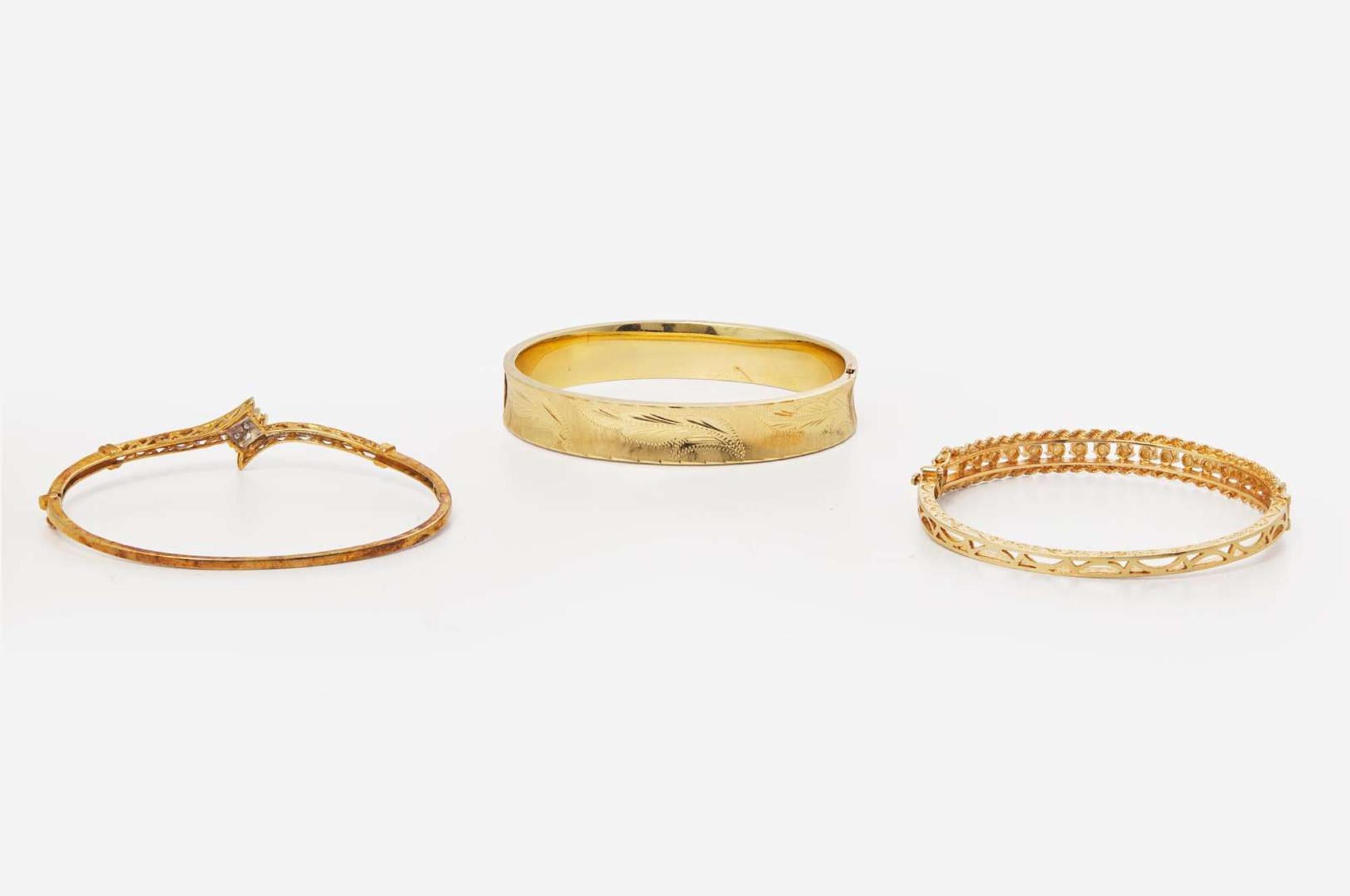A Collection of Yellow Gold Bangles