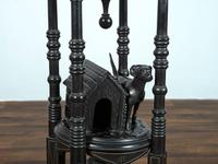A Victorian Marble-Top Carved and Ebonized Parlor Table with Dog