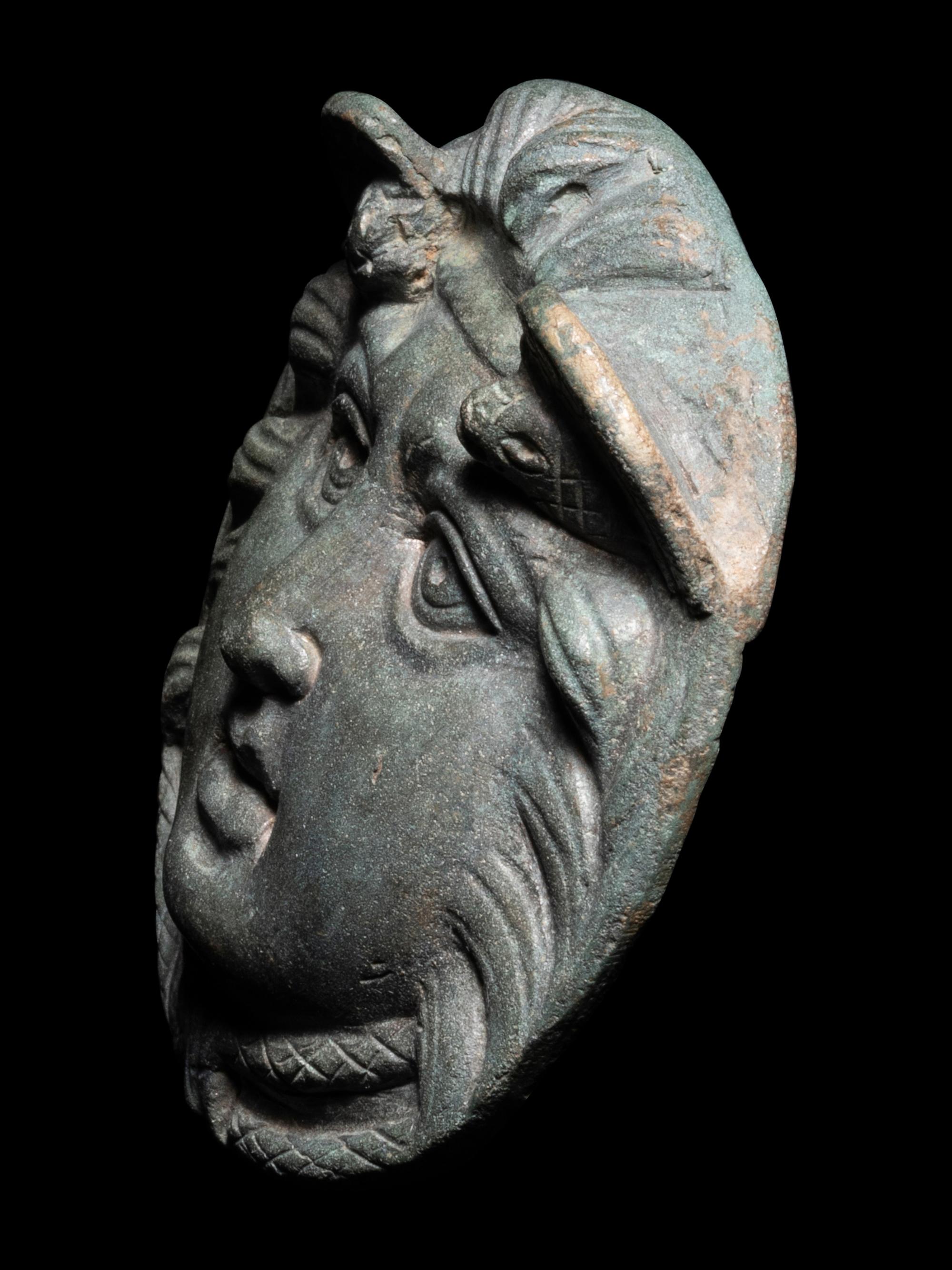 A Roman Bronze Roundel with Head of a Gorgon