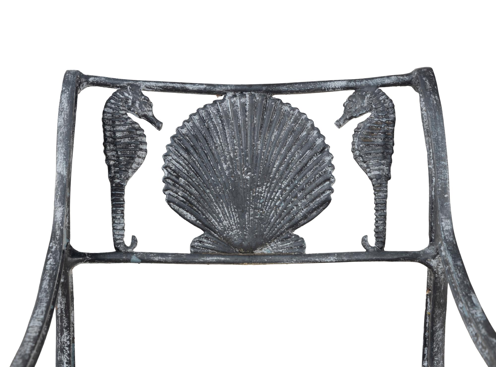 Four Wrought Iron Armchairs