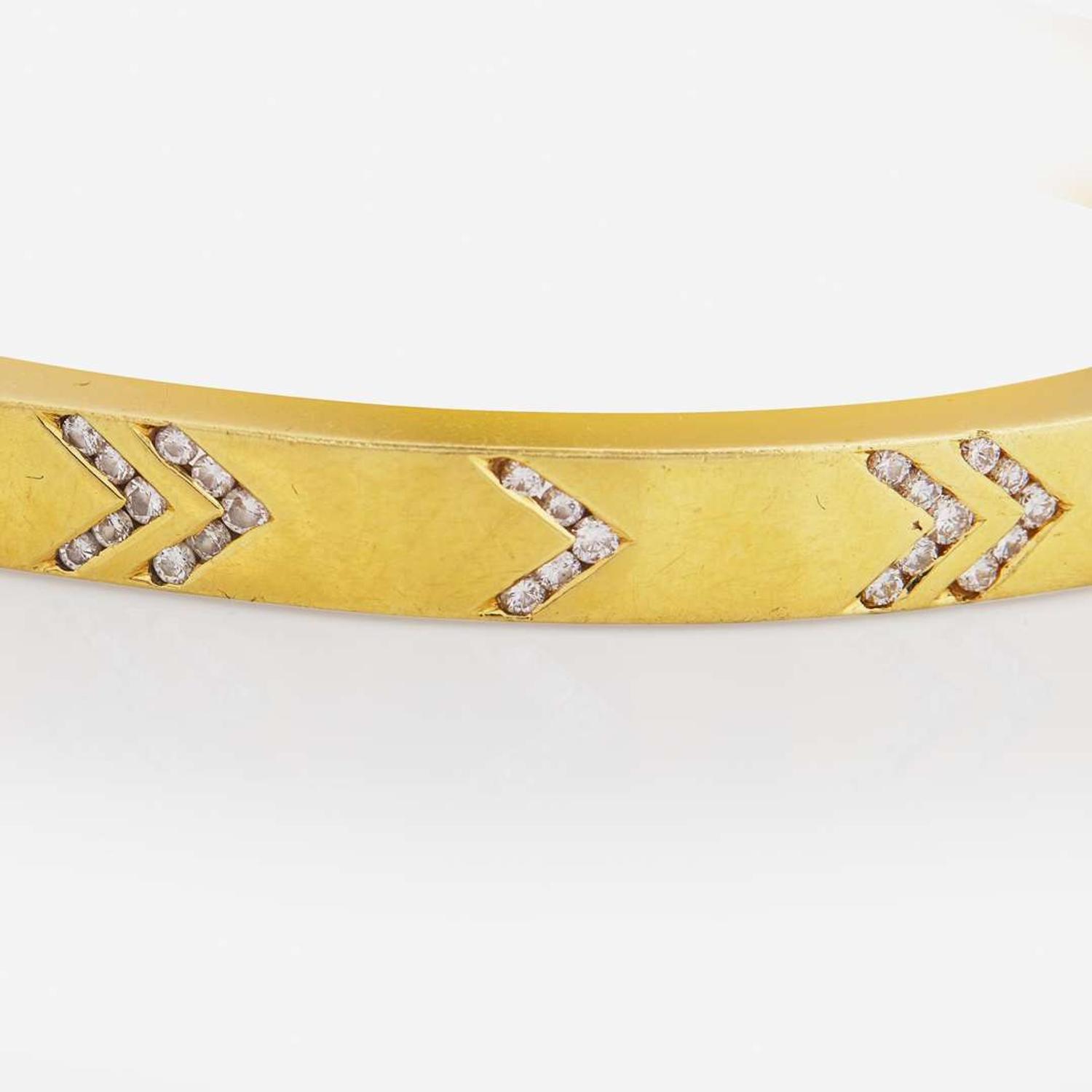 An 18K Yellow Gold and Diamond Bangle