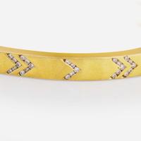 An 18K Yellow Gold and Diamond Bangle