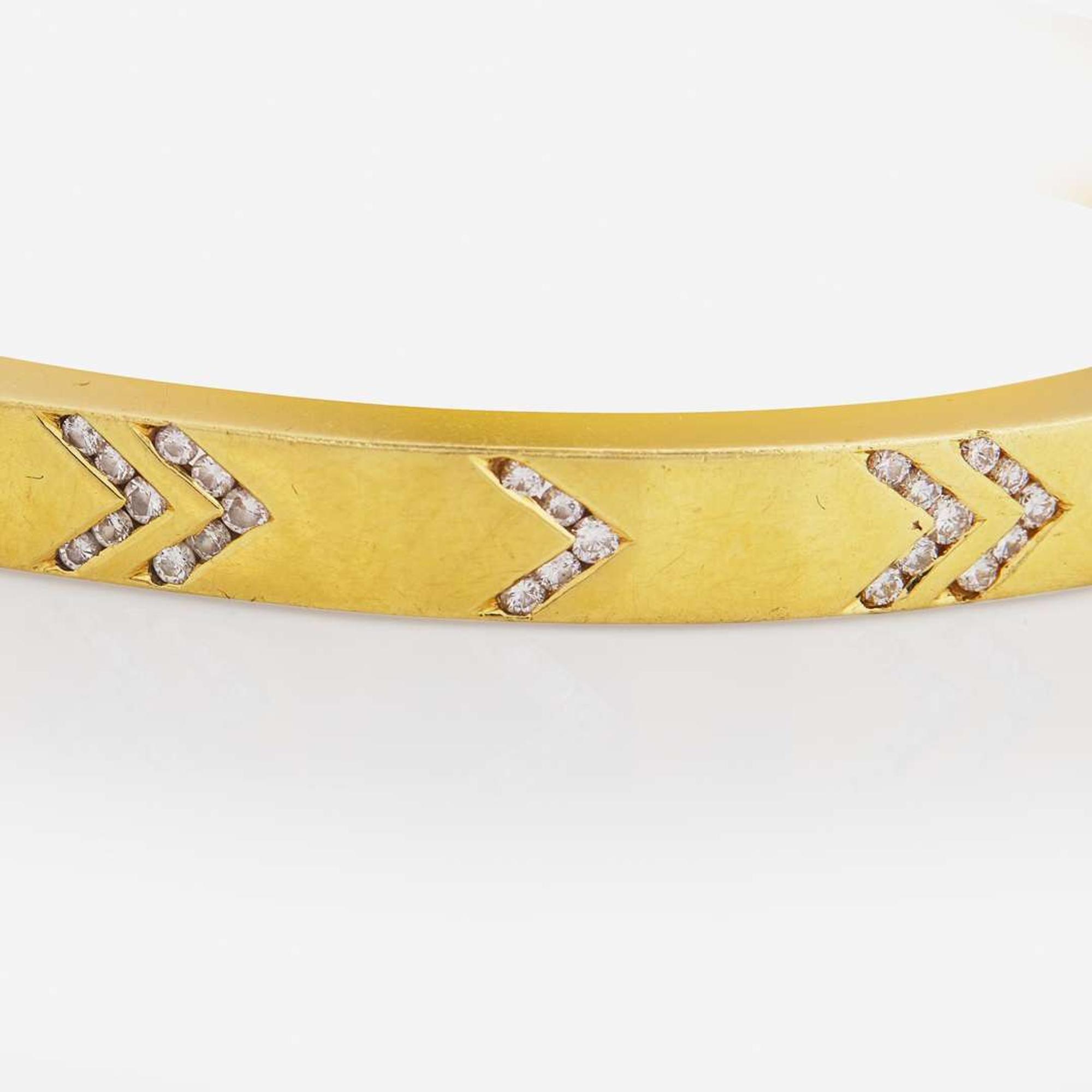 An 18K Yellow Gold and Diamond Bangle