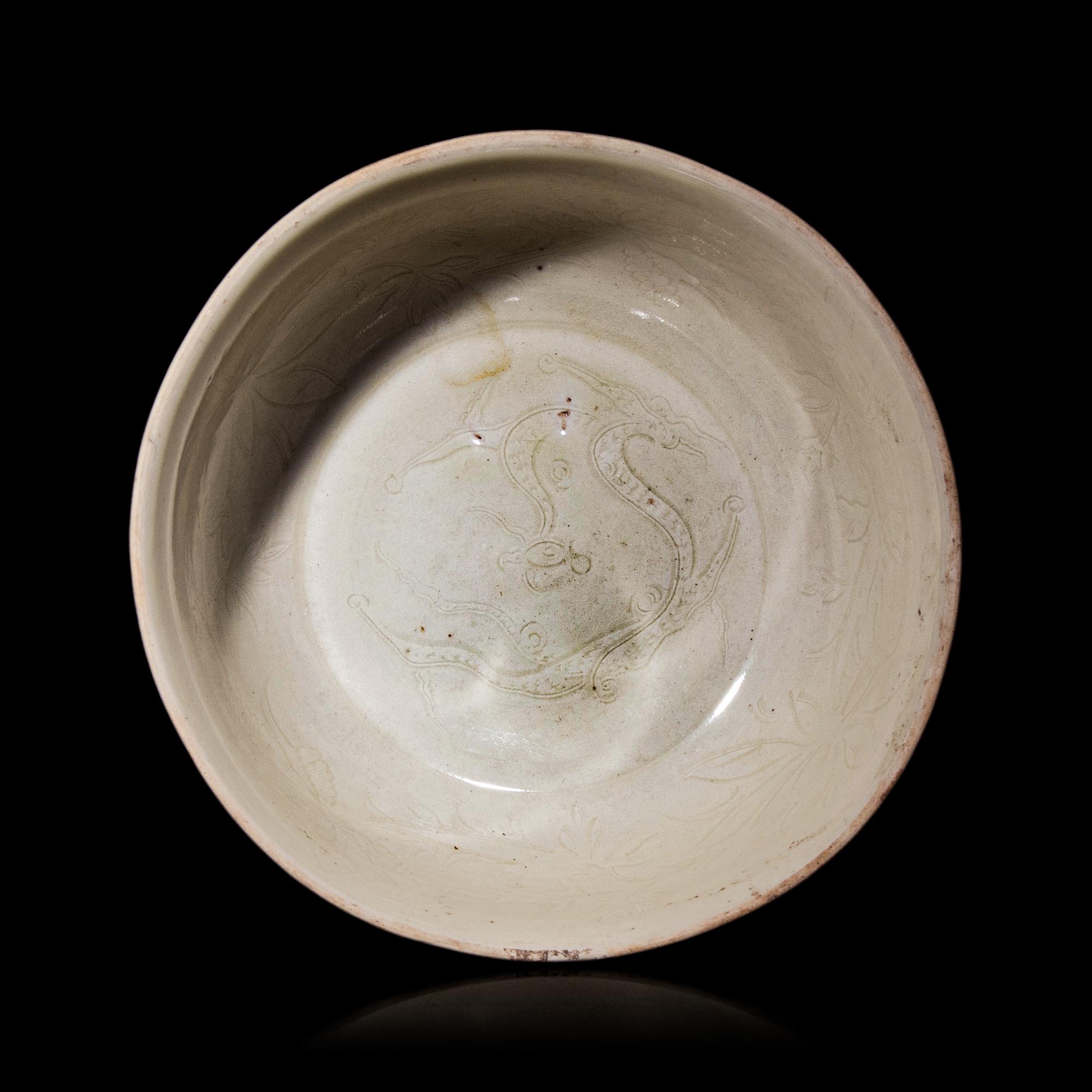 A Chinese Ding -Style Incised White Glazed Porcelain Bowl, Possibly Song Dynasty 或為宋 定窯白釉劃花鳳穿牡丹紋碗