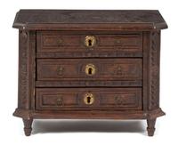 A Carved Oak Salesman's Sample Chest of Drawers Height 10 1/2 inches. — 19TH CENTURY
