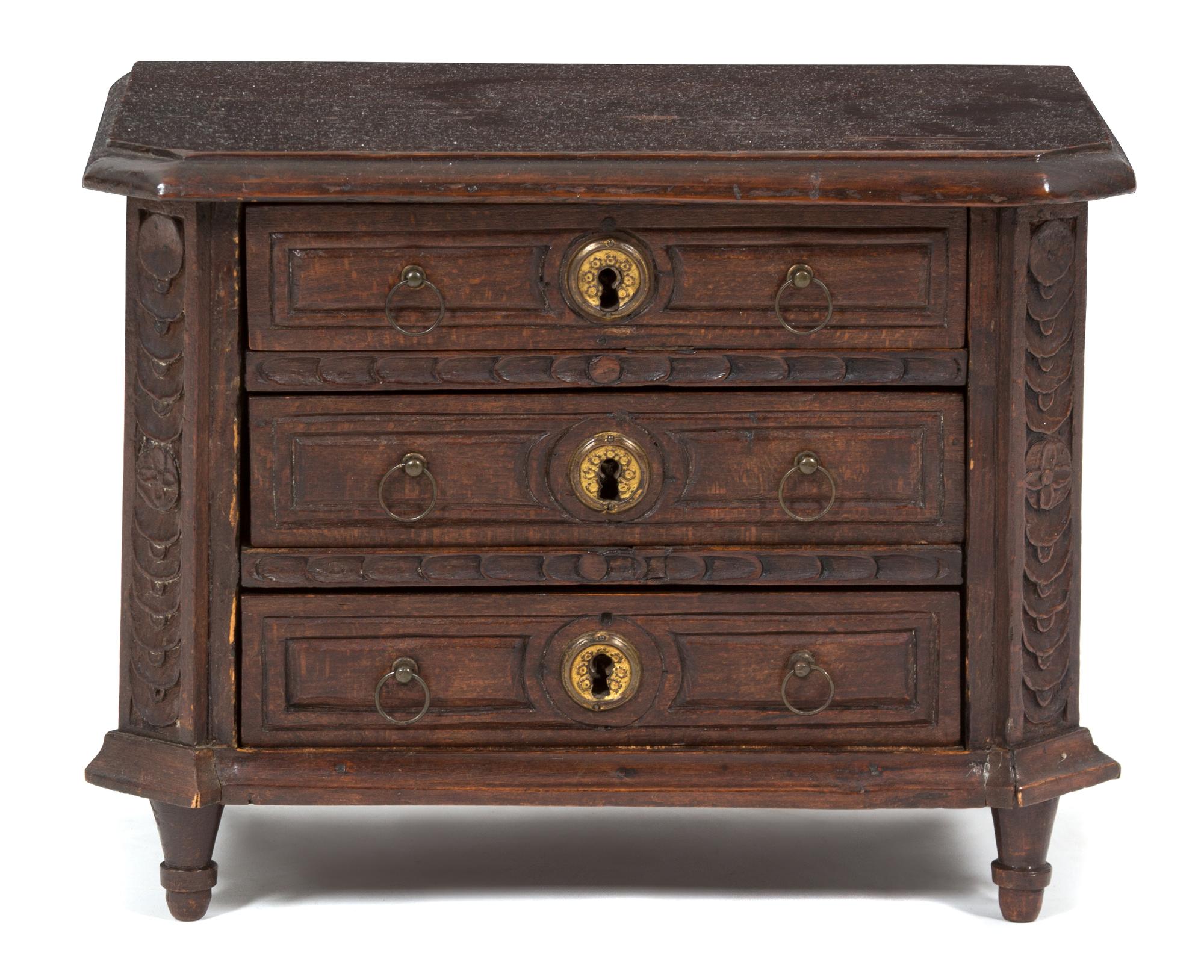 A Carved Oak Salesman's Sample Chest of Drawers Height 10 1/2 inches. — 19TH CENTURY