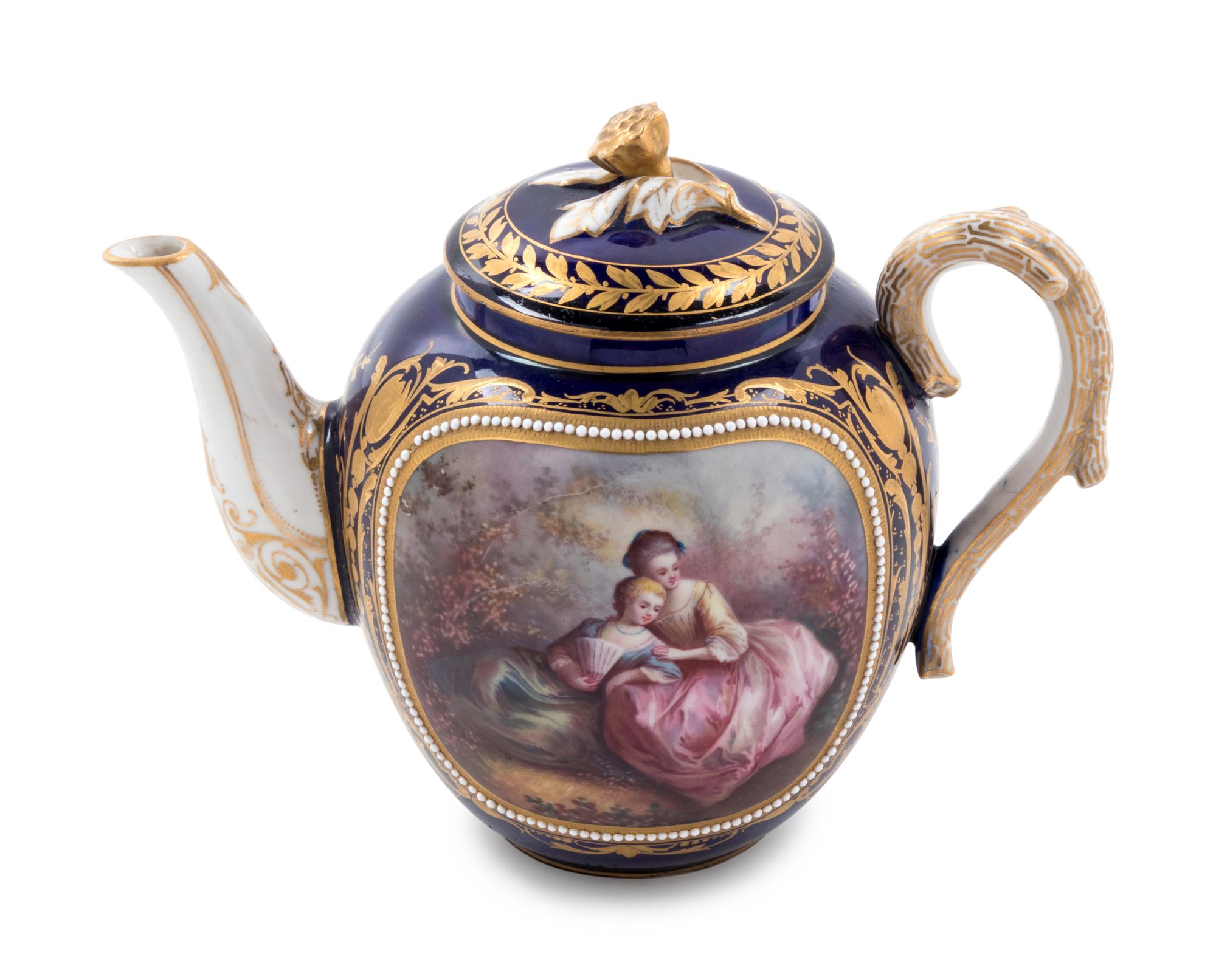 A Sèvres Style Painted, Parcel Gilt and "Jeweled" Porcelain Teapot