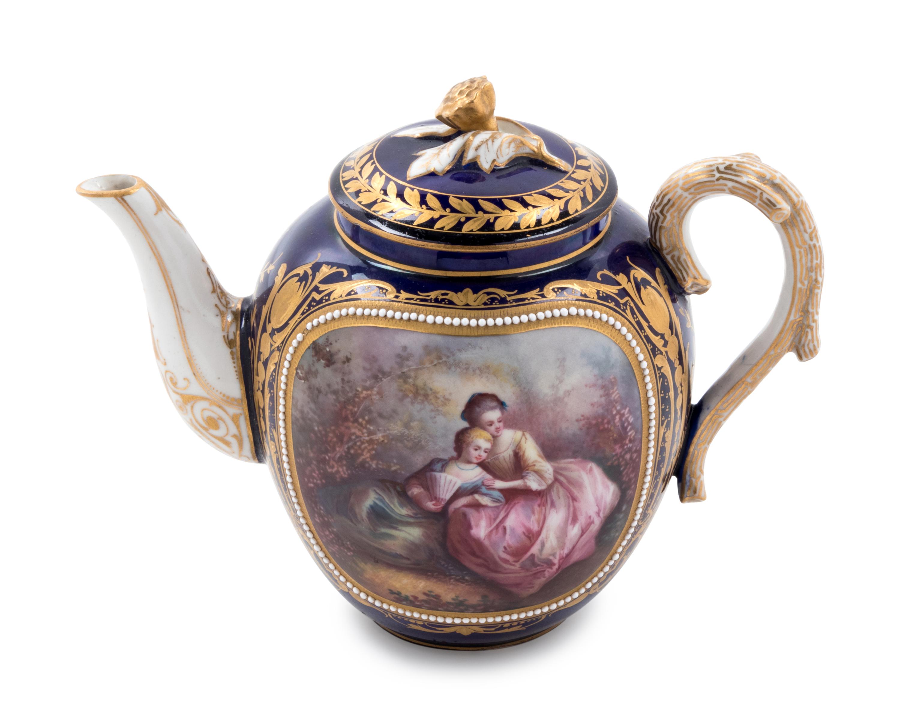 A Sèvres Style Painted, Parcel Gilt and "Jeweled" Porcelain Teapot
