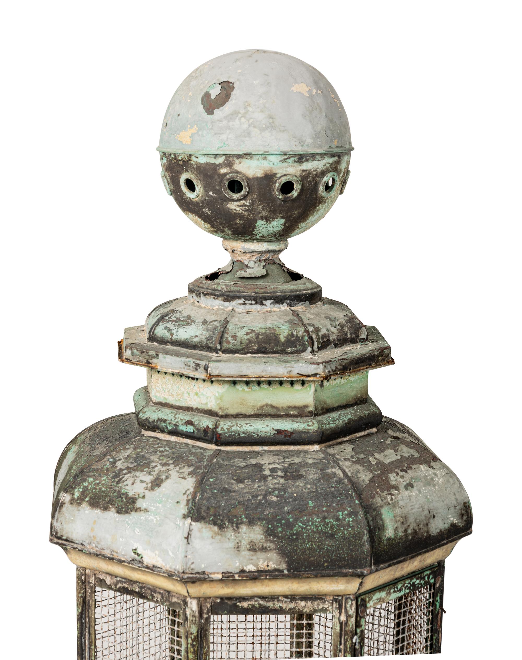 A Pair of Weathered Painted Sheet Metal Lanterns Converted to Bird Cages