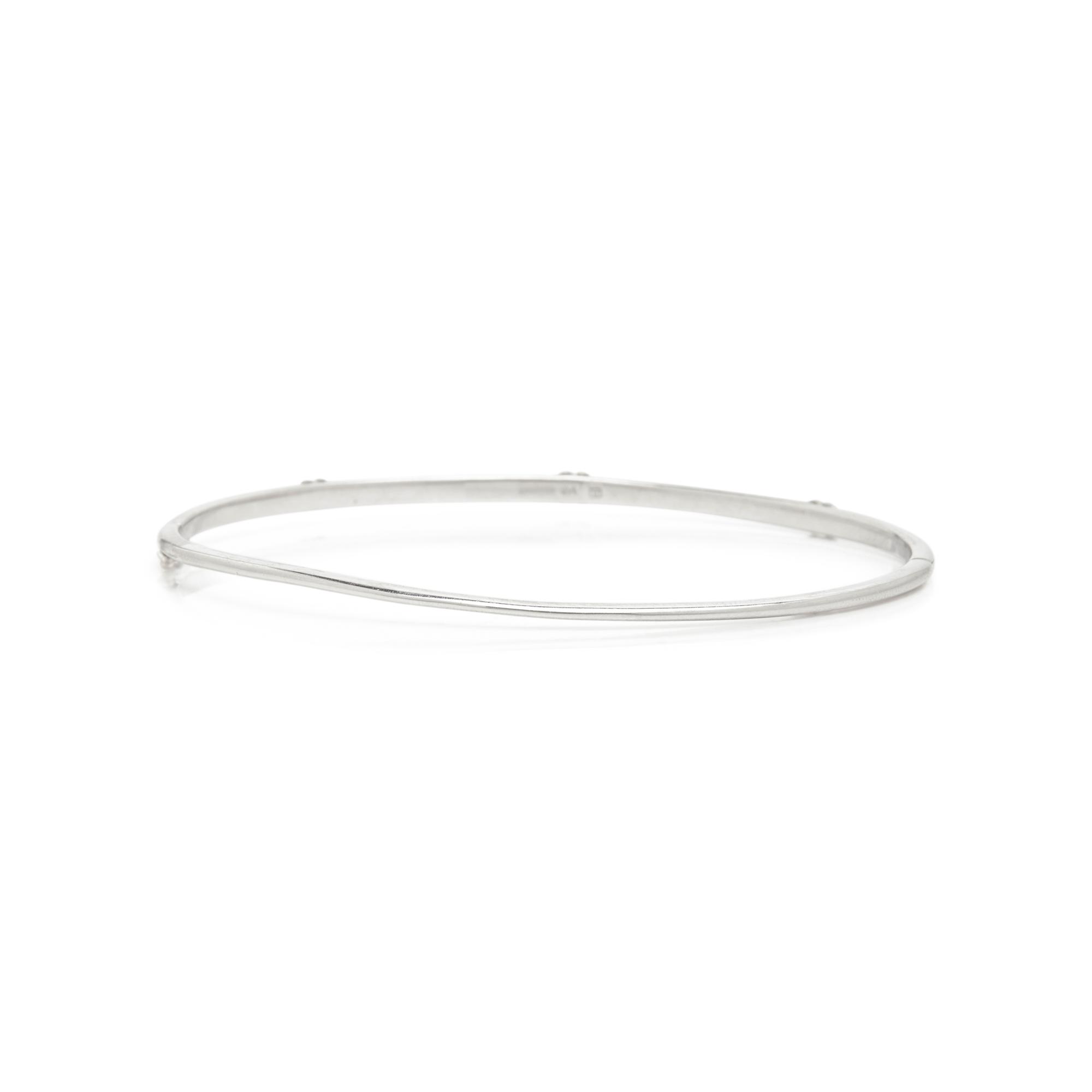 ANNA SHEFFIELD, WHITE GOLD AND DIAMOND 'CELESTINE THREE CLUSTER' BANGLE BRACELET