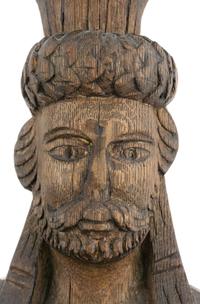 A Group of Three Carved Oak Figural Pilasters