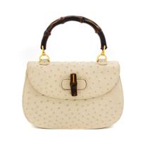A Gucci Cream Ostrich Bamboo Top Handle Bag, 10.5" x 7.5" x 3".