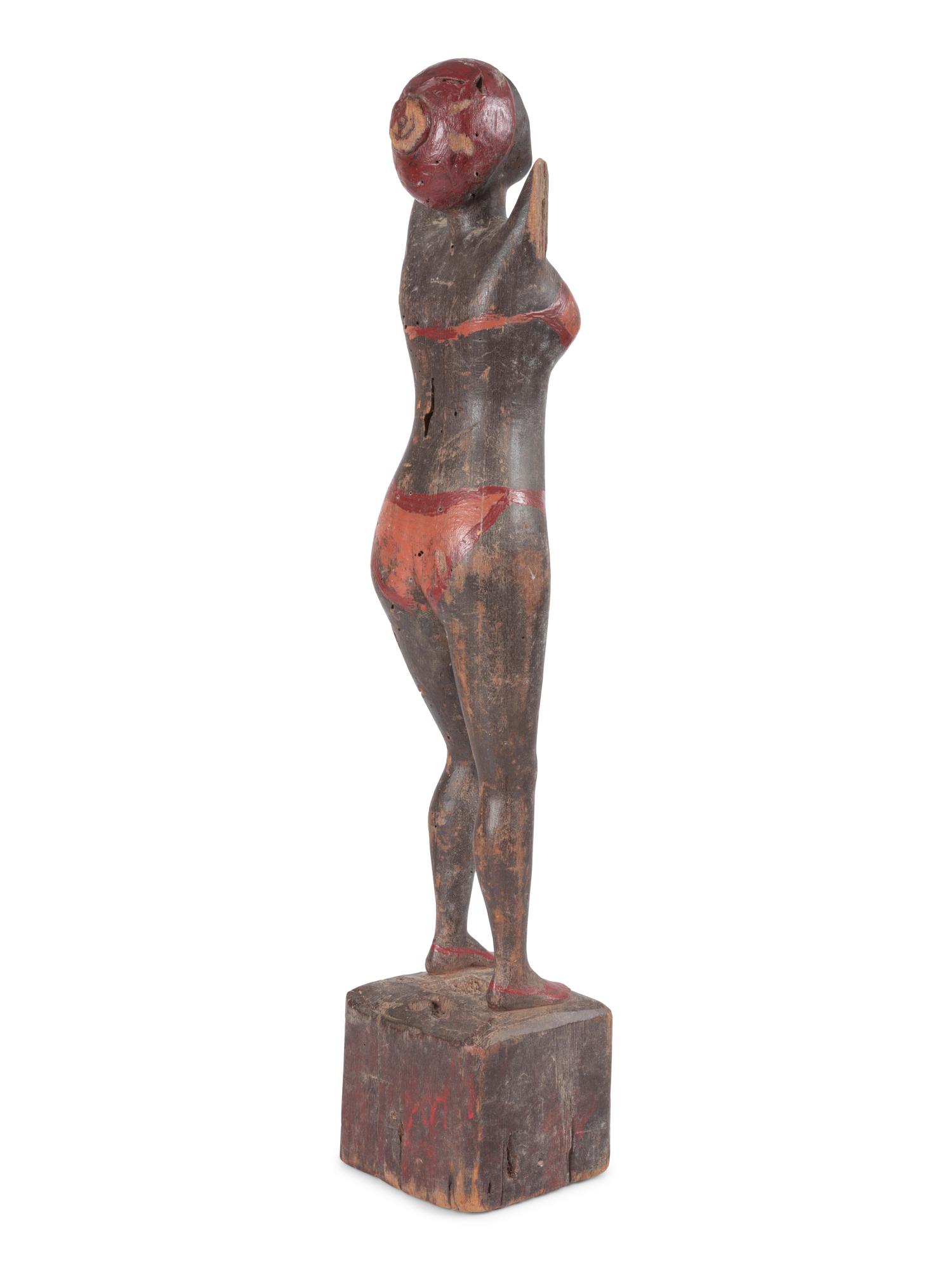 A Carved and Painted Wood Bather Figure