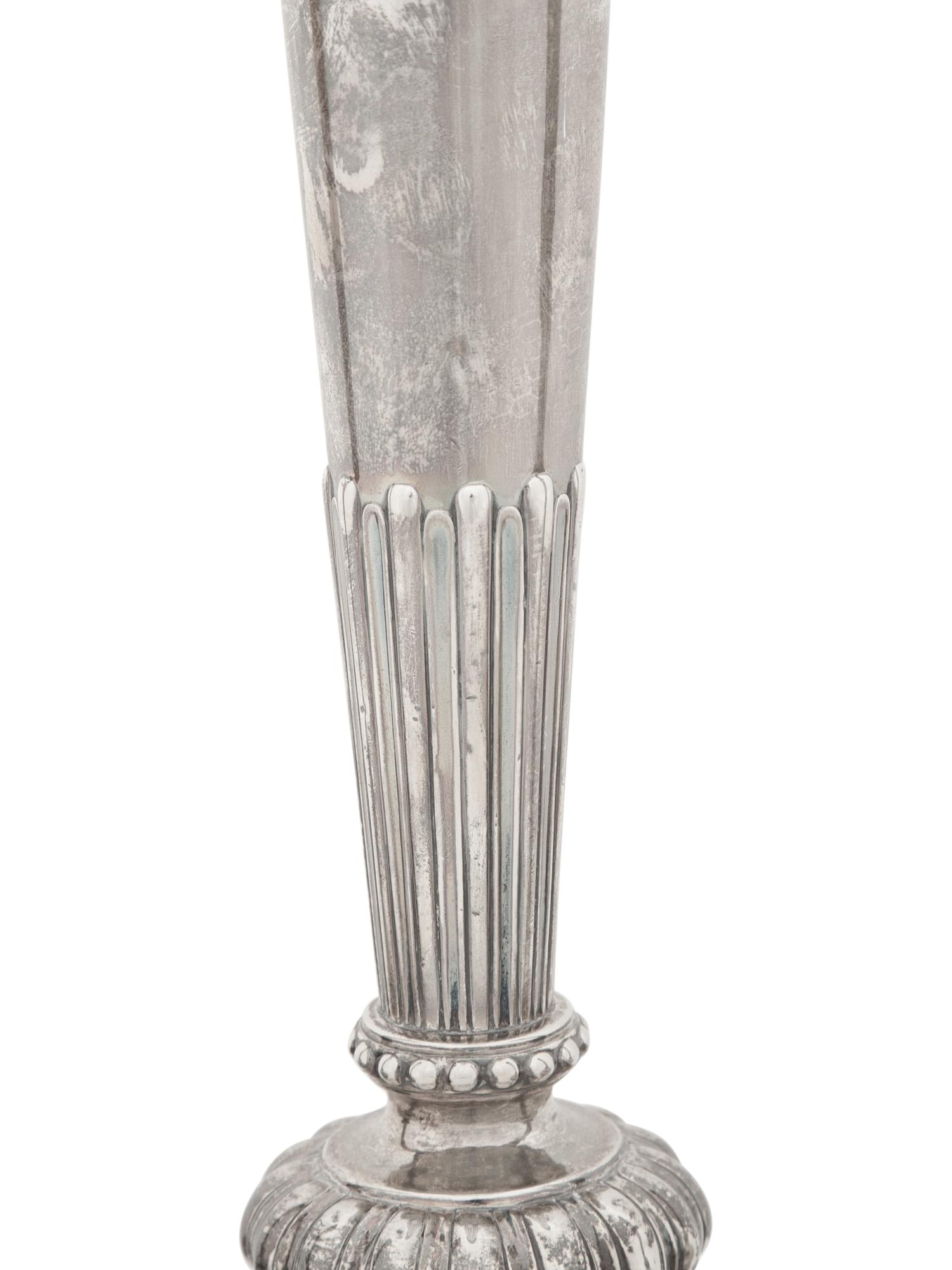A Set of Four Victorian Silver Candlesticks