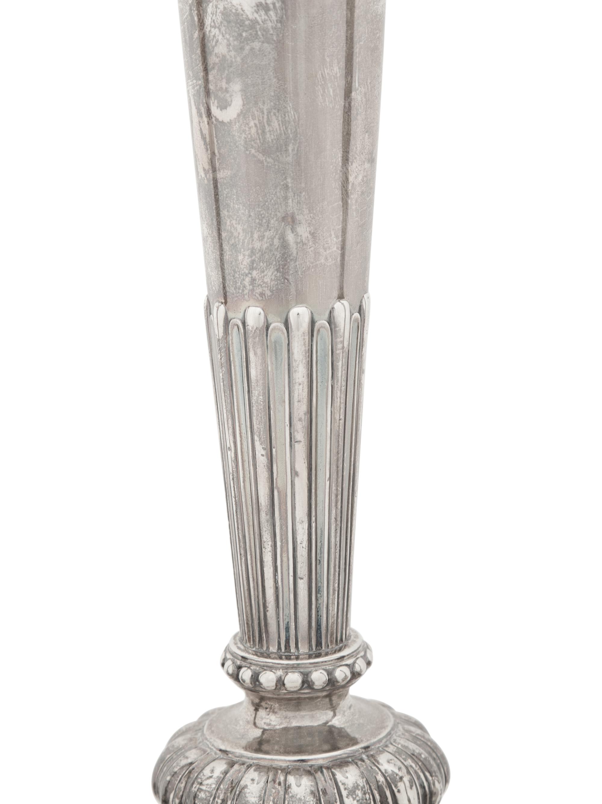 A Set of Four Victorian Silver Candlesticks