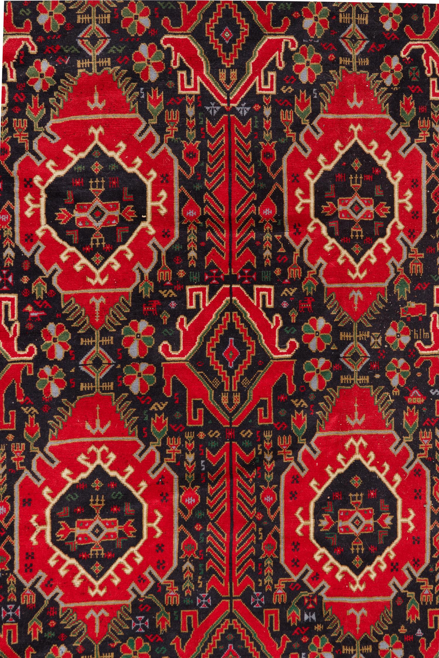 A Persian Bokhara Wool Rug