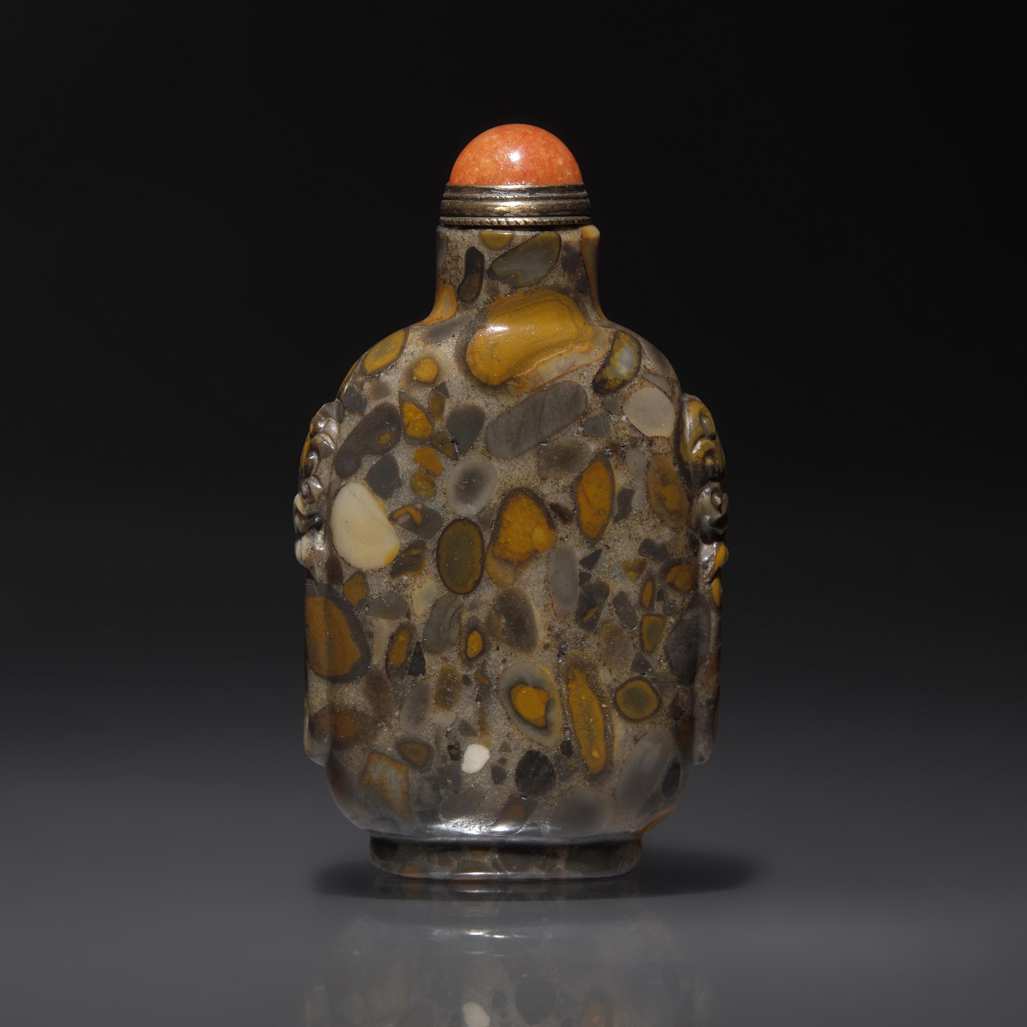 A Chinese Puddingstone Snuff Bottle, Qing Dynasty, Circa 1750-1860 — 1750–1860年 抱子石鋪首啣環耳鼻煙壺