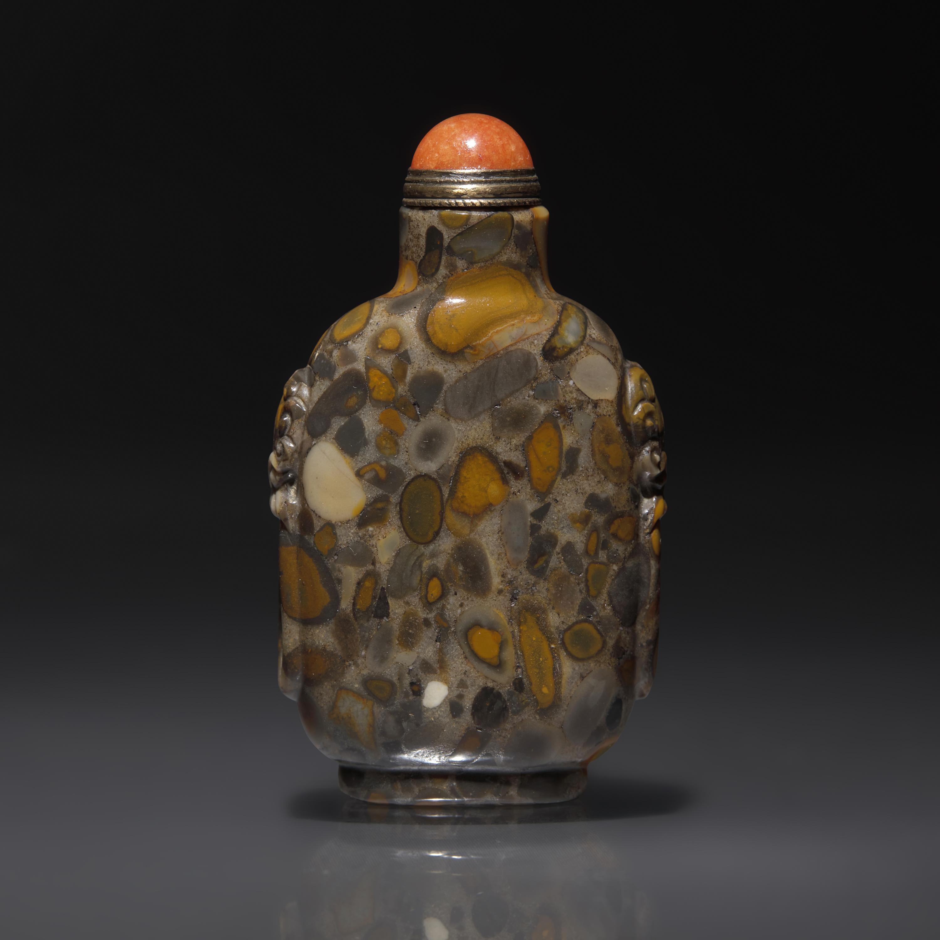 A Chinese Puddingstone Snuff Bottle, Qing Dynasty, Circa 1750-1860 — 1750–1860年 抱子石鋪首啣環耳鼻煙壺
