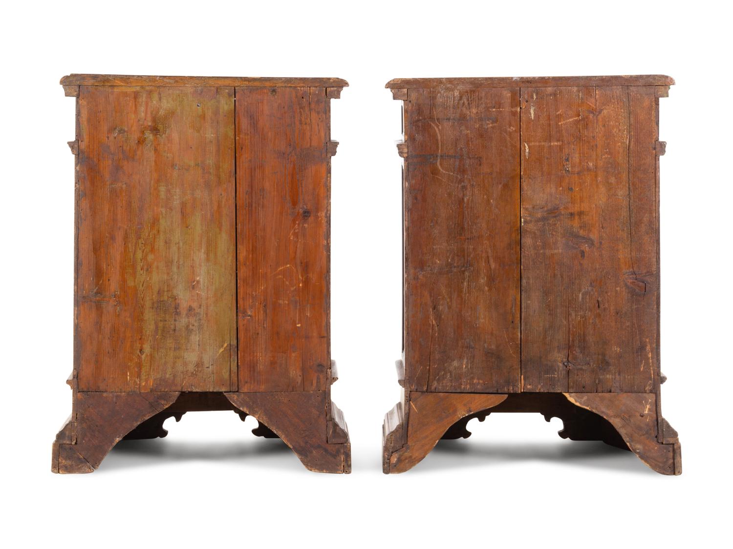 A Pair of North Italian Carved and Paneled Walnut Cabinets