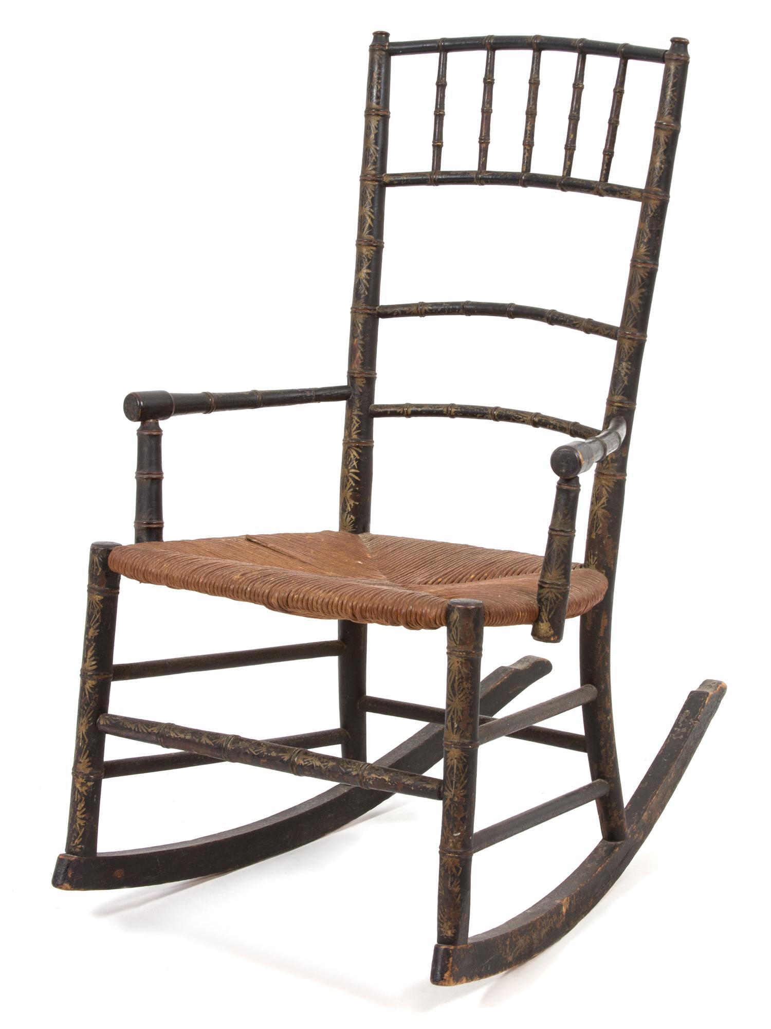 An English Regency Diminutive Ebonized and Gilt Rocking Chair Height 31 1/2 inches. — 19TH CENTURY
