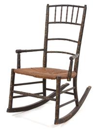 An English Regency Diminutive Ebonized and Gilt Rocking Chair Height 31 1/2 inches. — 19TH CENTURY