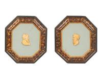 A Pair of Continental Faux Tortoiseshell Painted Framed Composition Plaques of Profile Busts