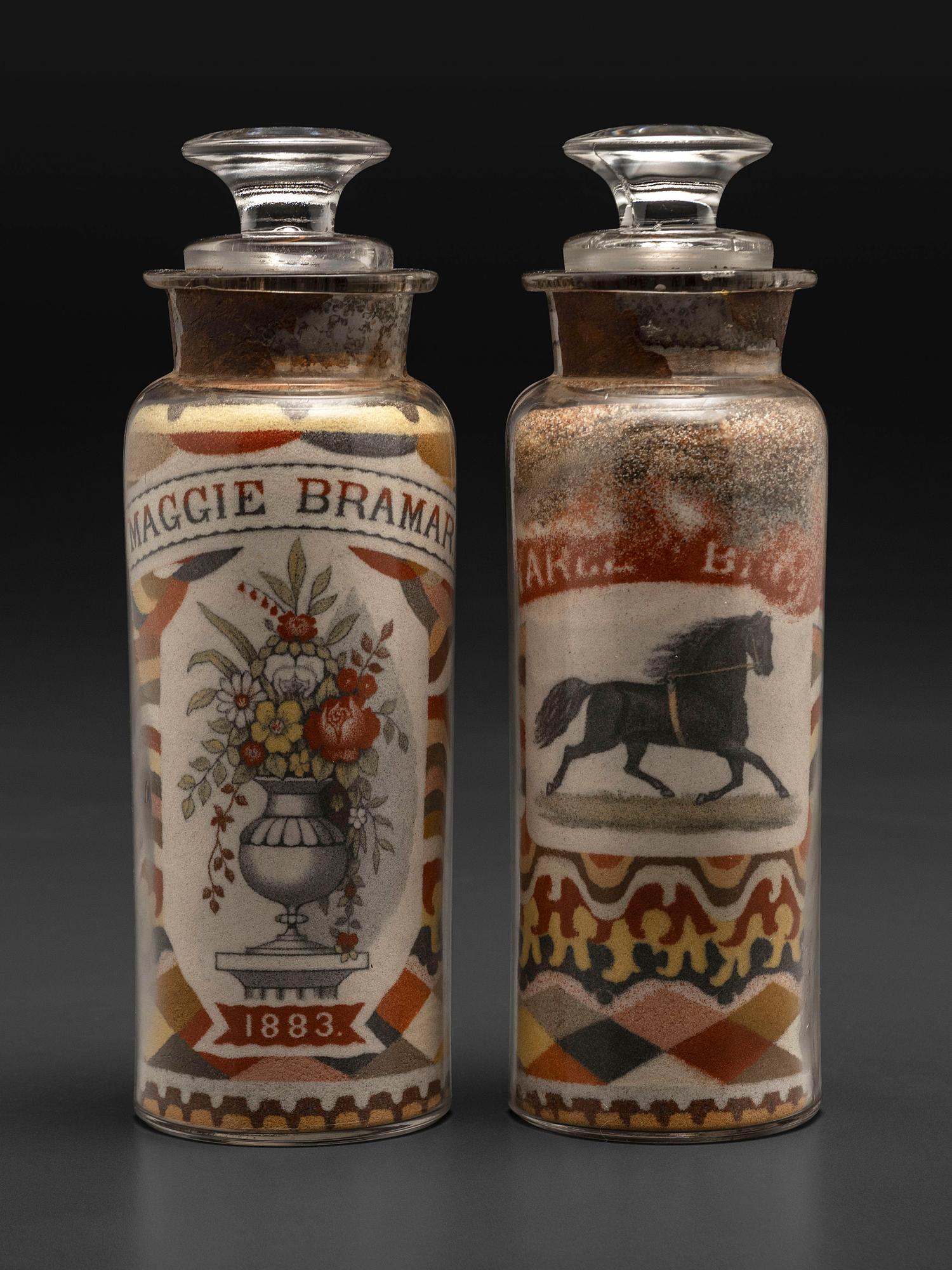 A Pair of Andrew Clemens (American, 1857-1894) 'Sweetheart' Sand Bottles