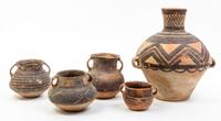 A Group of Nine Neolithic Style Pottery Vessels Height of tallest 12 inches.