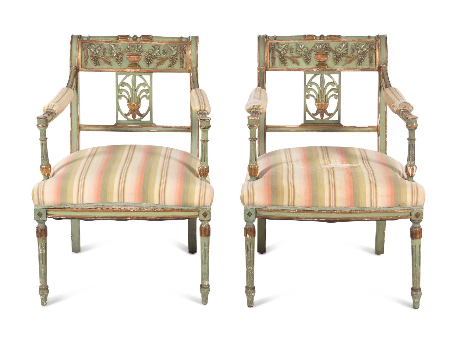 A Pair of Neoclassical Painted and Parcel Gilt Armchairs