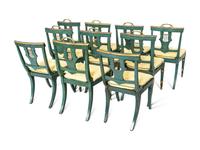 A Set of Eight Continental Green Painted and Parcel Gilt Lyre-Back Dining Chairs