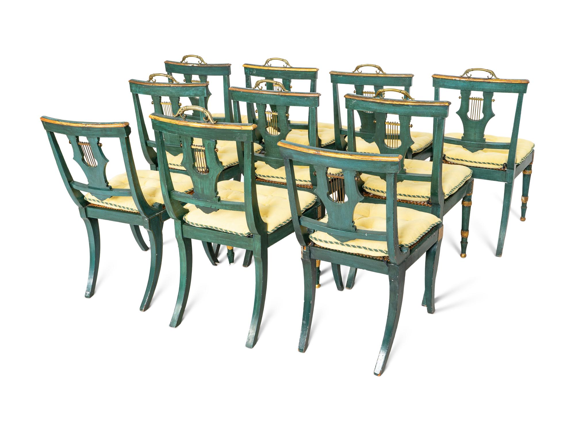 A Set of Eight Continental Green Painted and Parcel Gilt Lyre-Back Dining Chairs