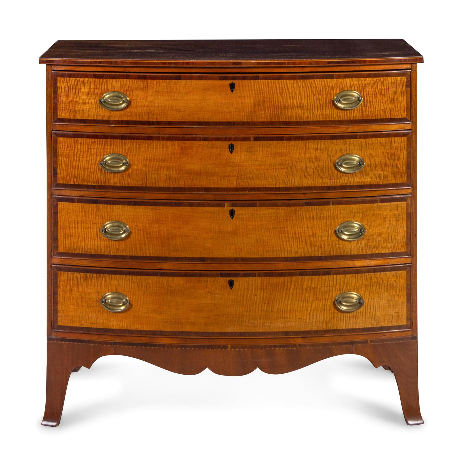 A Federal Tiger Maple and Mahogany Bow Front Chest of Drawers
