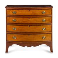 A Federal Tiger Maple and Mahogany Bow Front Chest of Drawers