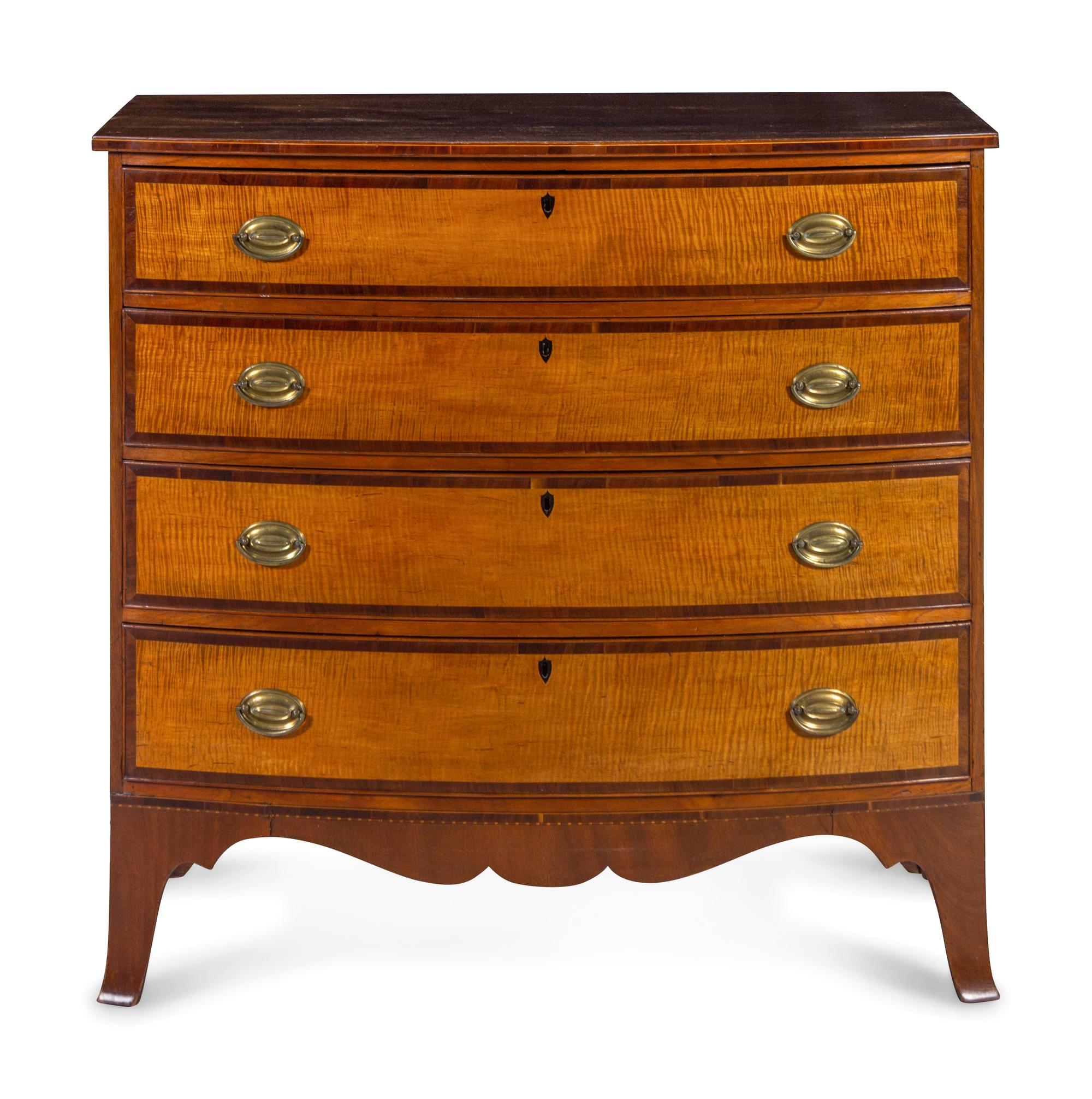 A Federal Tiger Maple and Mahogany Bow Front Chest of Drawers