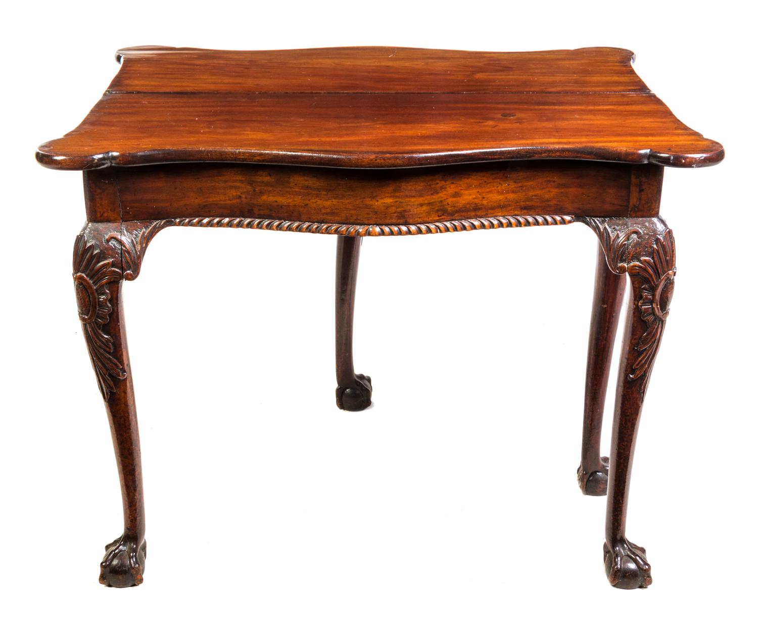 A George II Style Mahogany Flip-Top Table Height 28 1/2 x width 36 1/4 x depth 36 1/4 inches (open). — 19TH CENTURY