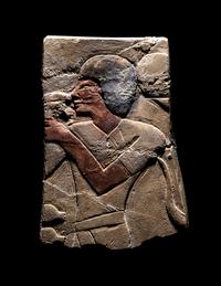 An Egyptian Painted Limestone Relief Fragment