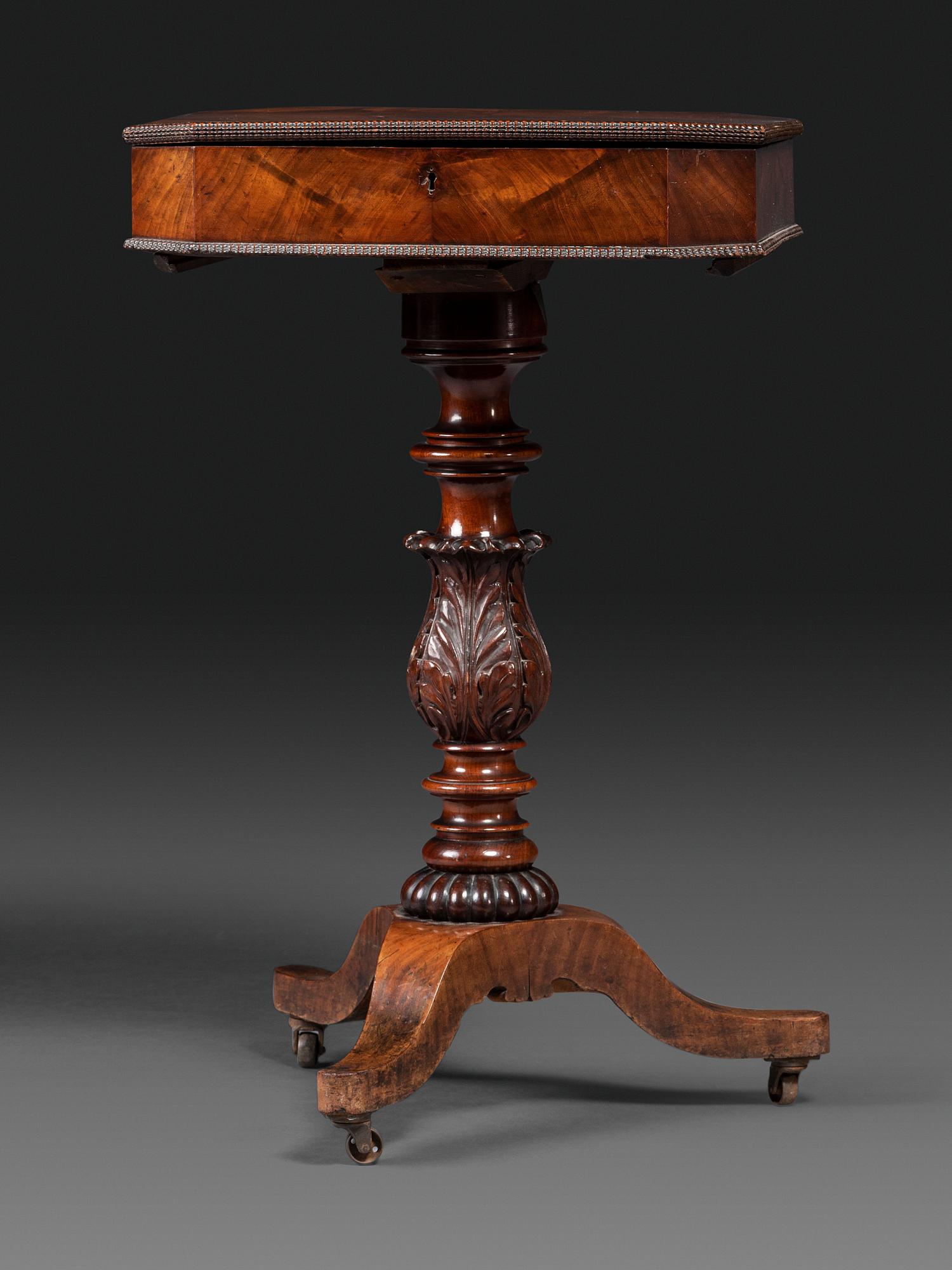 A Classical Carved and Figured Mahogany Work Table