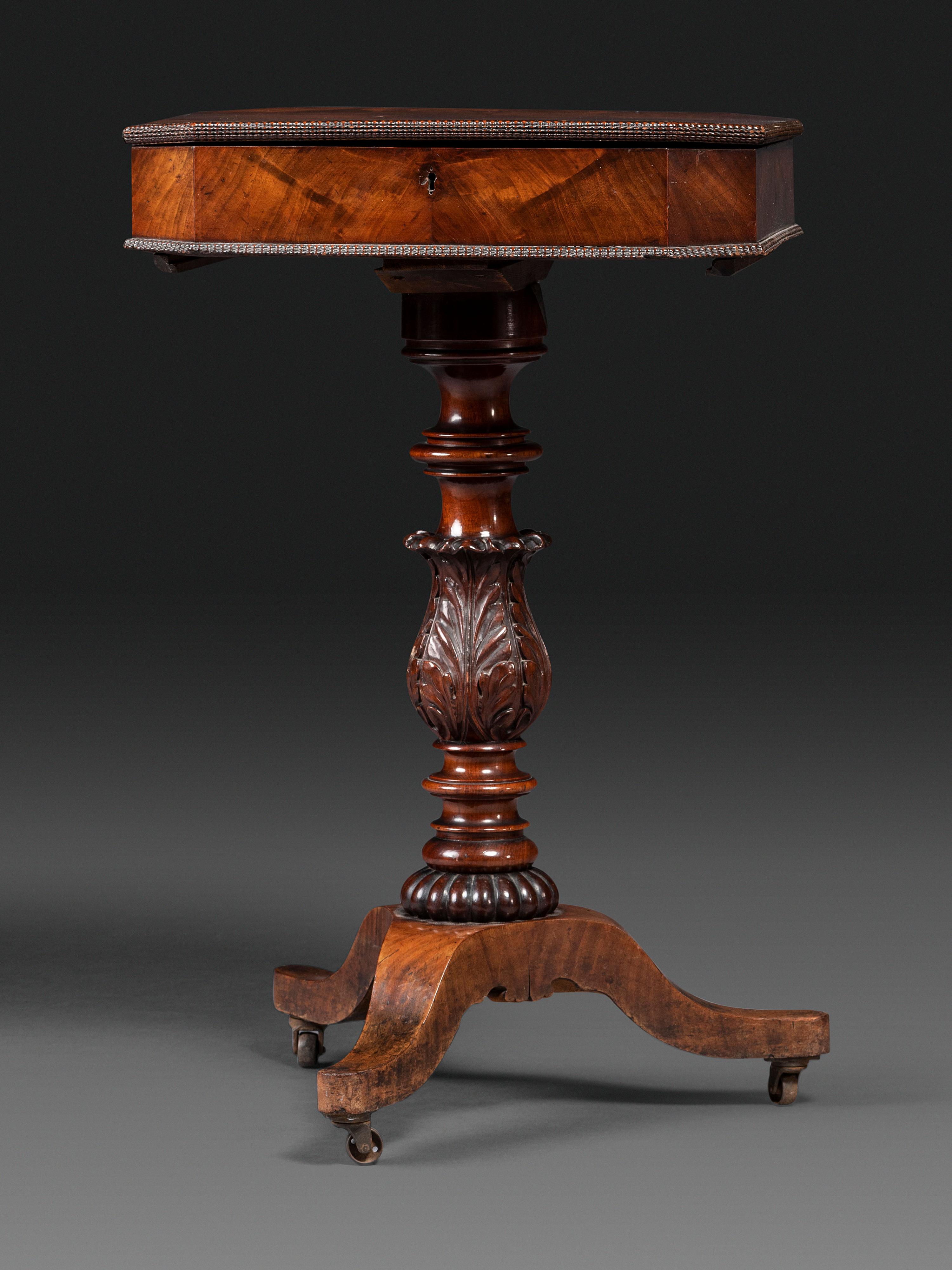 A Classical Carved and Figured Mahogany Work Table