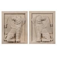 A Pair of Large Carved Granite Reliefs of Griffins
