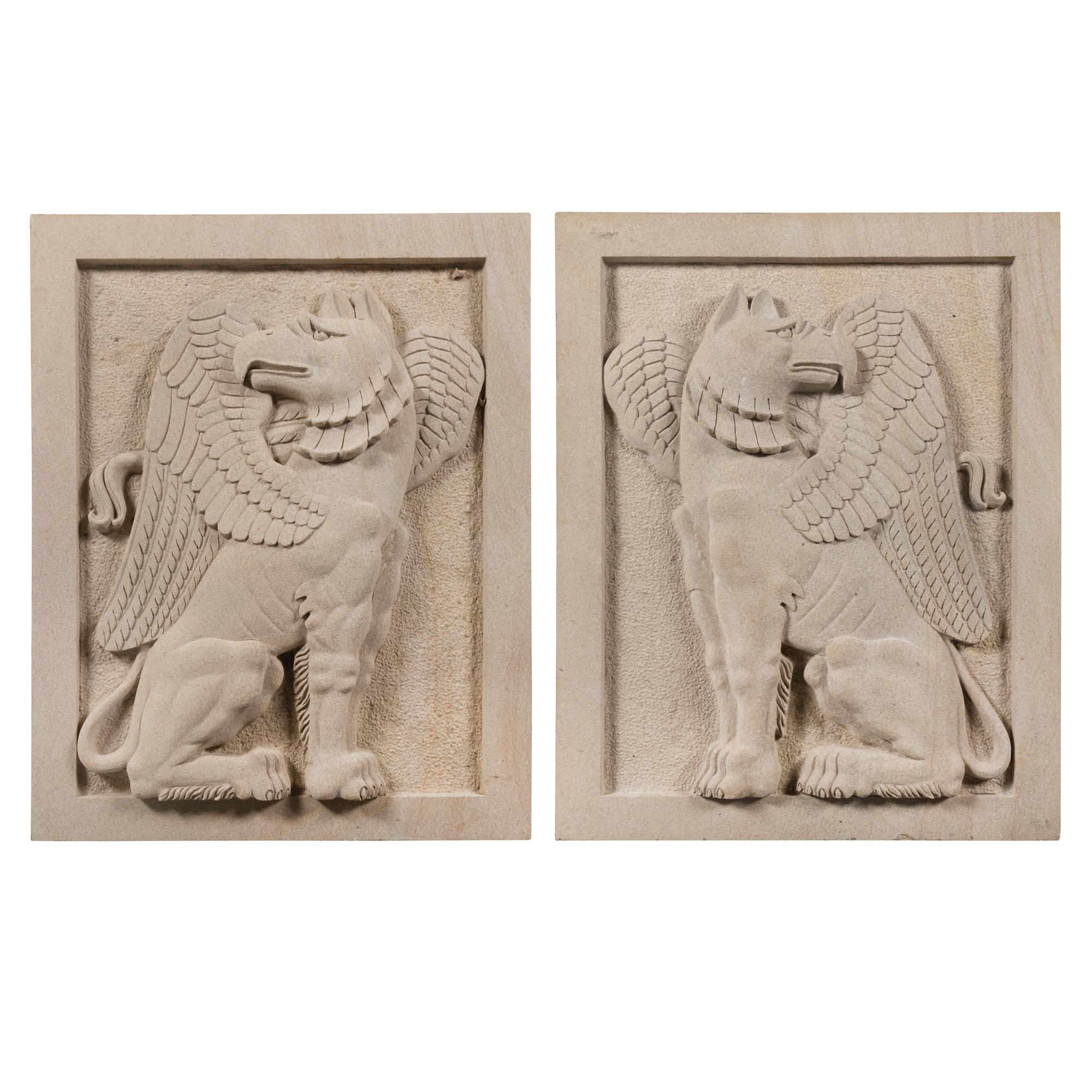A Pair of Large Carved Granite Reliefs of Griffins