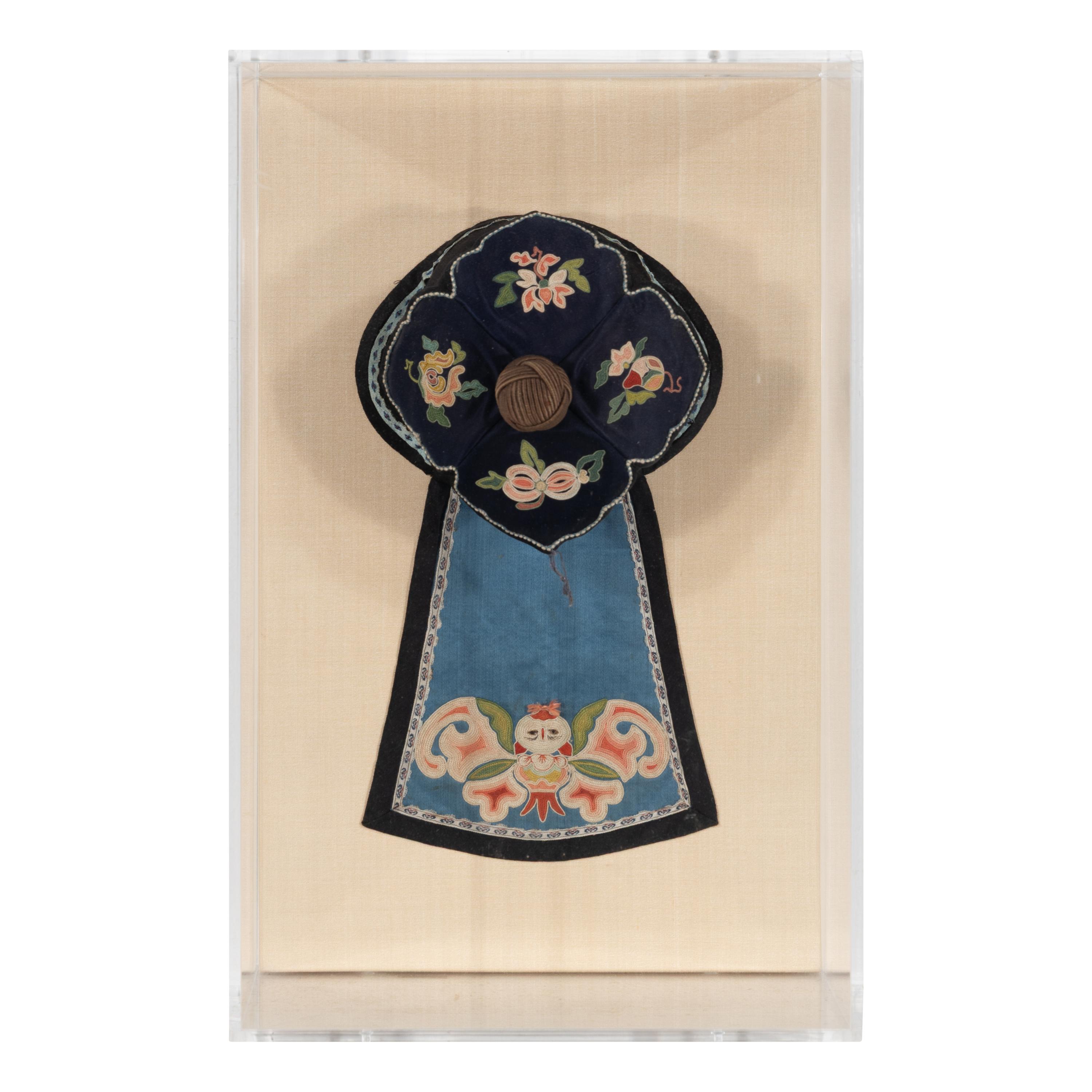 A Chinese Apricot Ground Embroidered Silk Apron Skirt and A Blue Ground Embroidered Silk Hat, 19th Century — 晚清 杏色地繡牡丹紋馬面裙及藍底繡瓜果紋帽