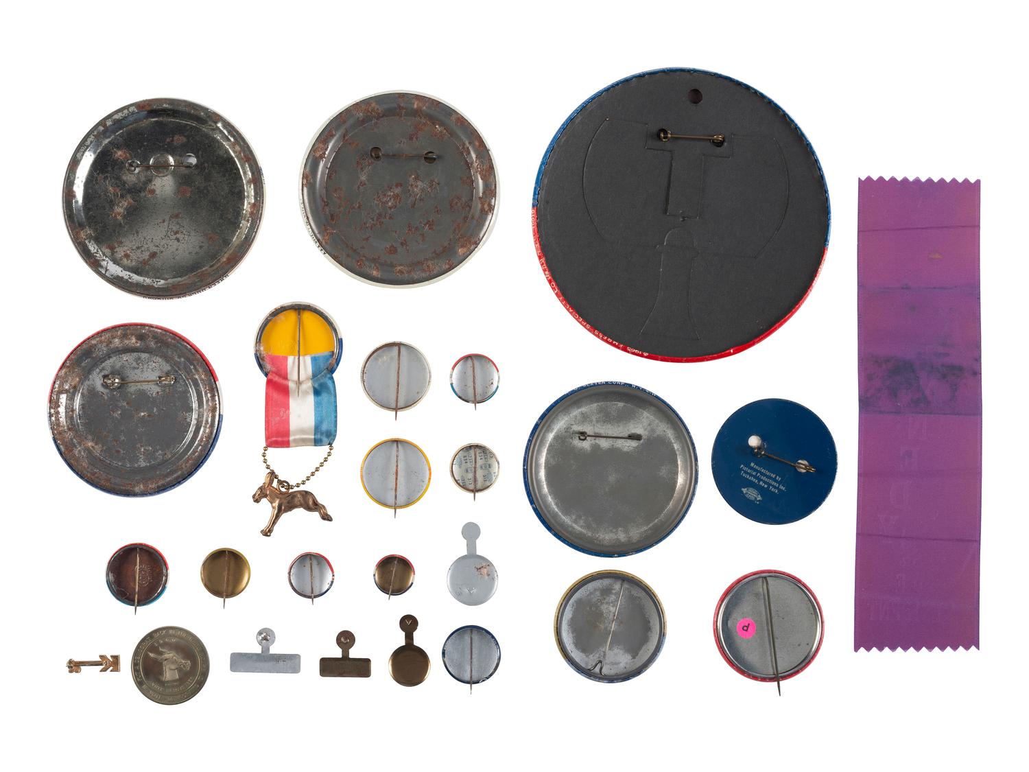 [KENNEDY, John F. (1917-1963)]. A group of 25 political buttons, token, and ribbon for John F. Kennedy, Bobby Kennedy, Teddy Kennedy, and Lyndon Johnson.