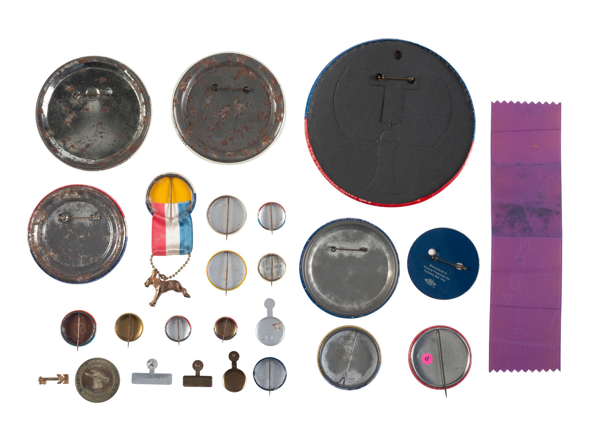 [KENNEDY, John F. (1917-1963)]. A group of 25 political buttons, token, and ribbon for John F. Kennedy, Bobby Kennedy, Teddy Kennedy, and Lyndon Johnson.